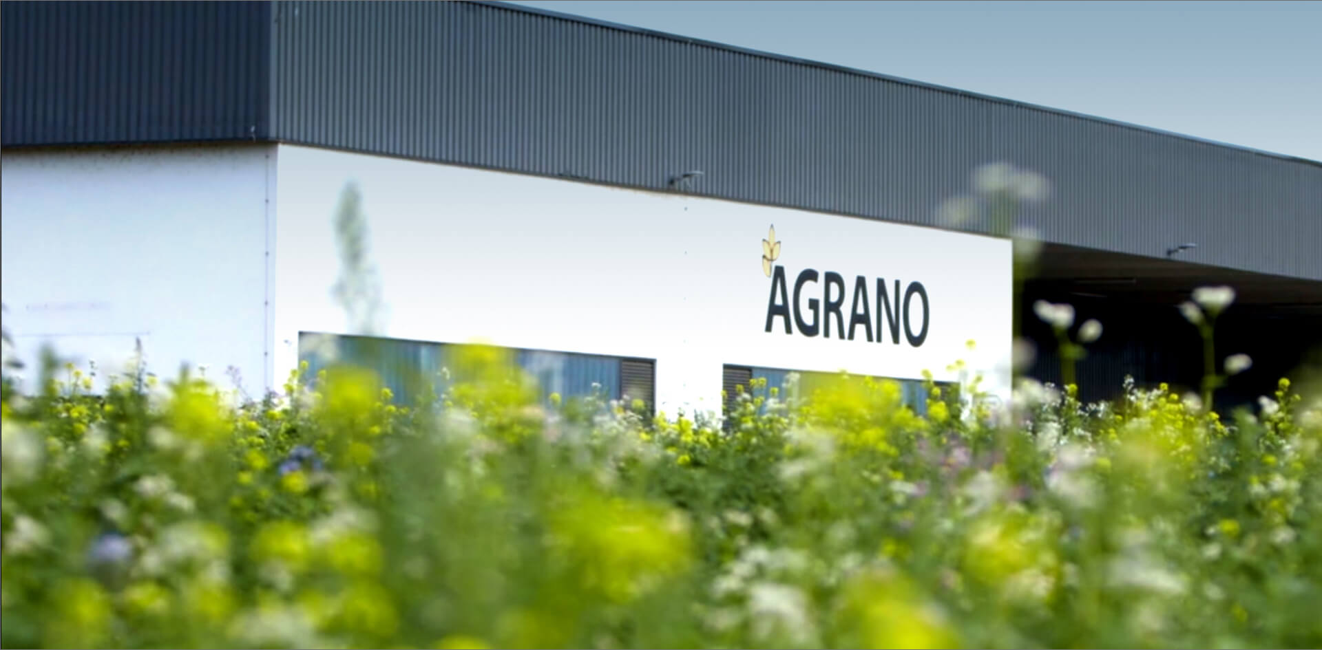 The logo of Agrano on the side of our company building